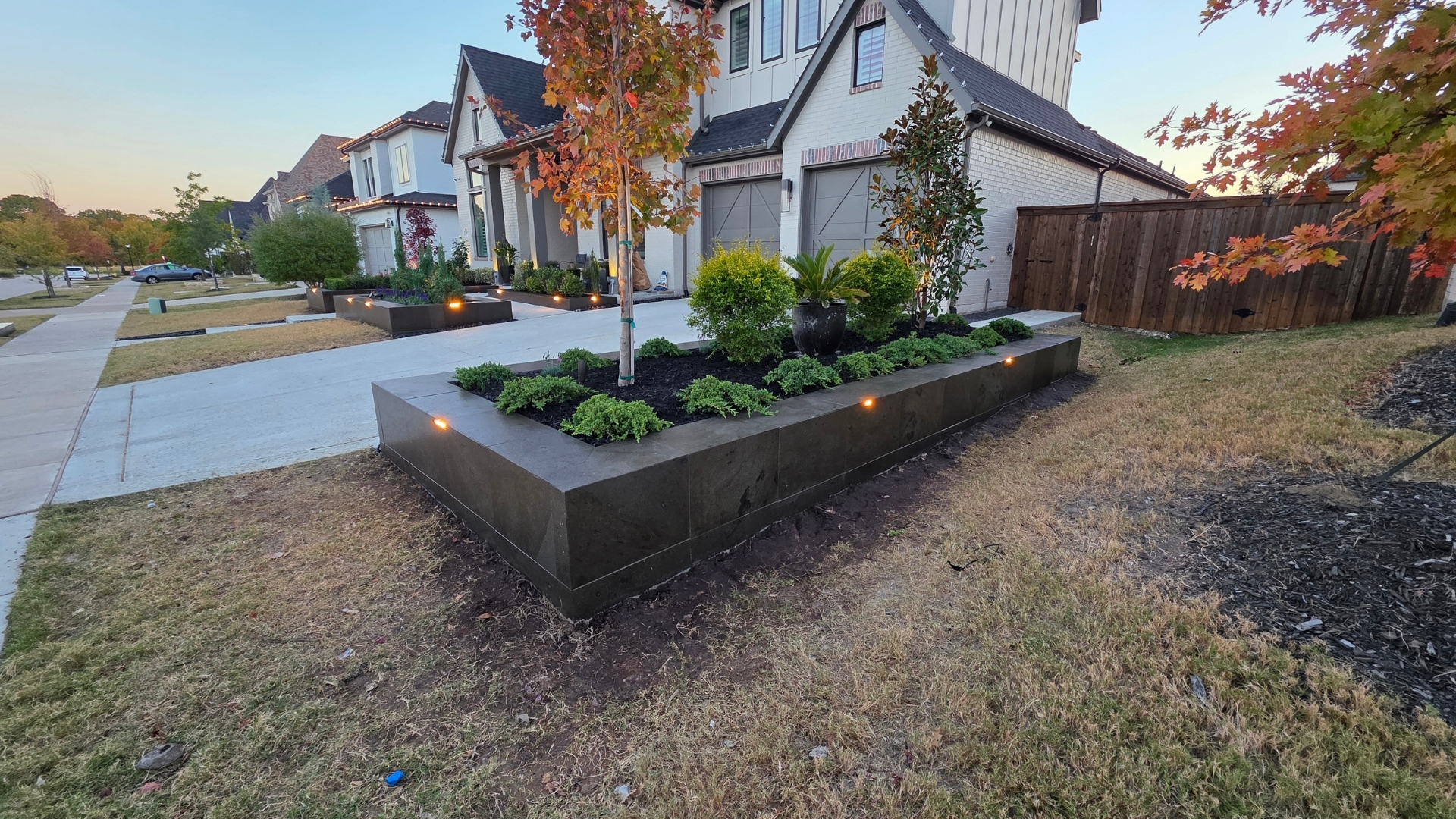modern-black-stone-raised-planters-led-cap-lights-prosper-frisco-tx