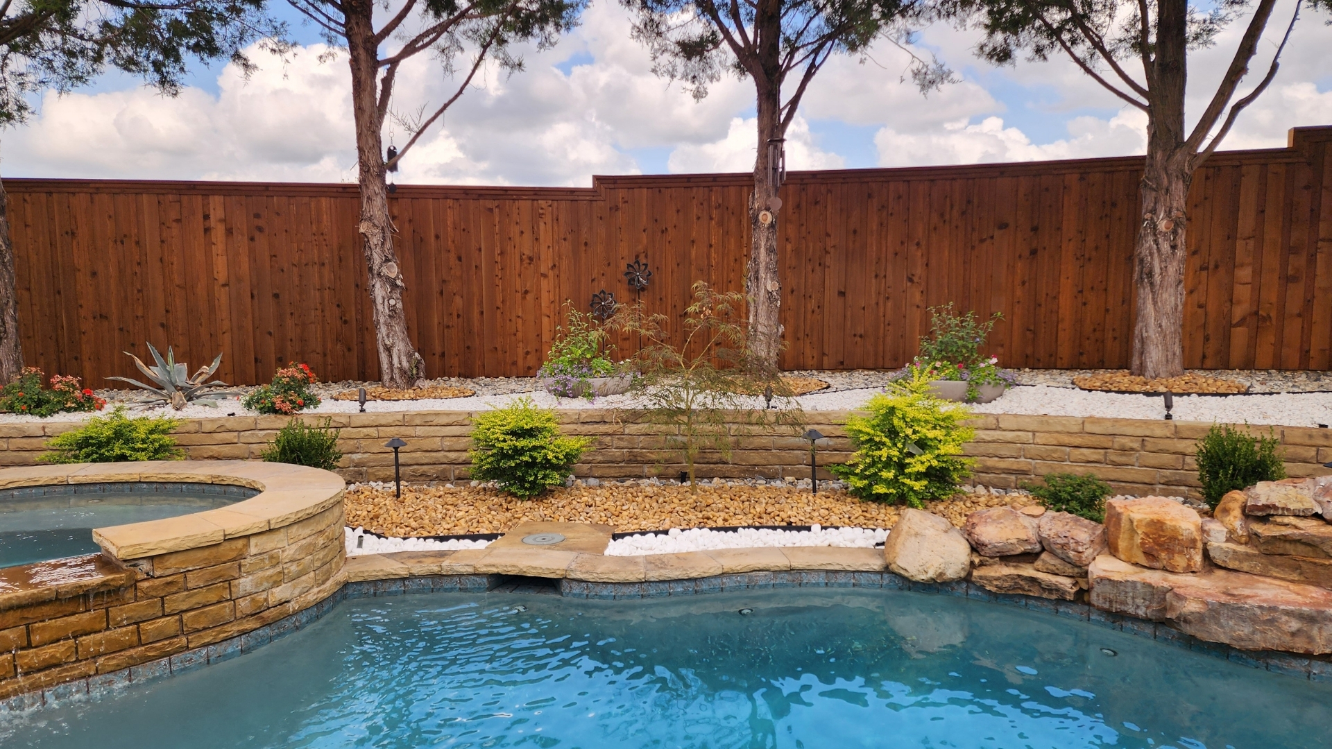 pool-waterfall-terraced-planters-white-tan-rock-frisco-prosper-tx